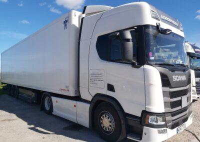 white truck interaxle curtain