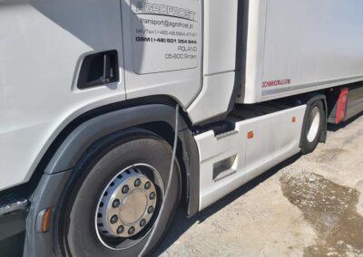 white truck interaxle curtain
